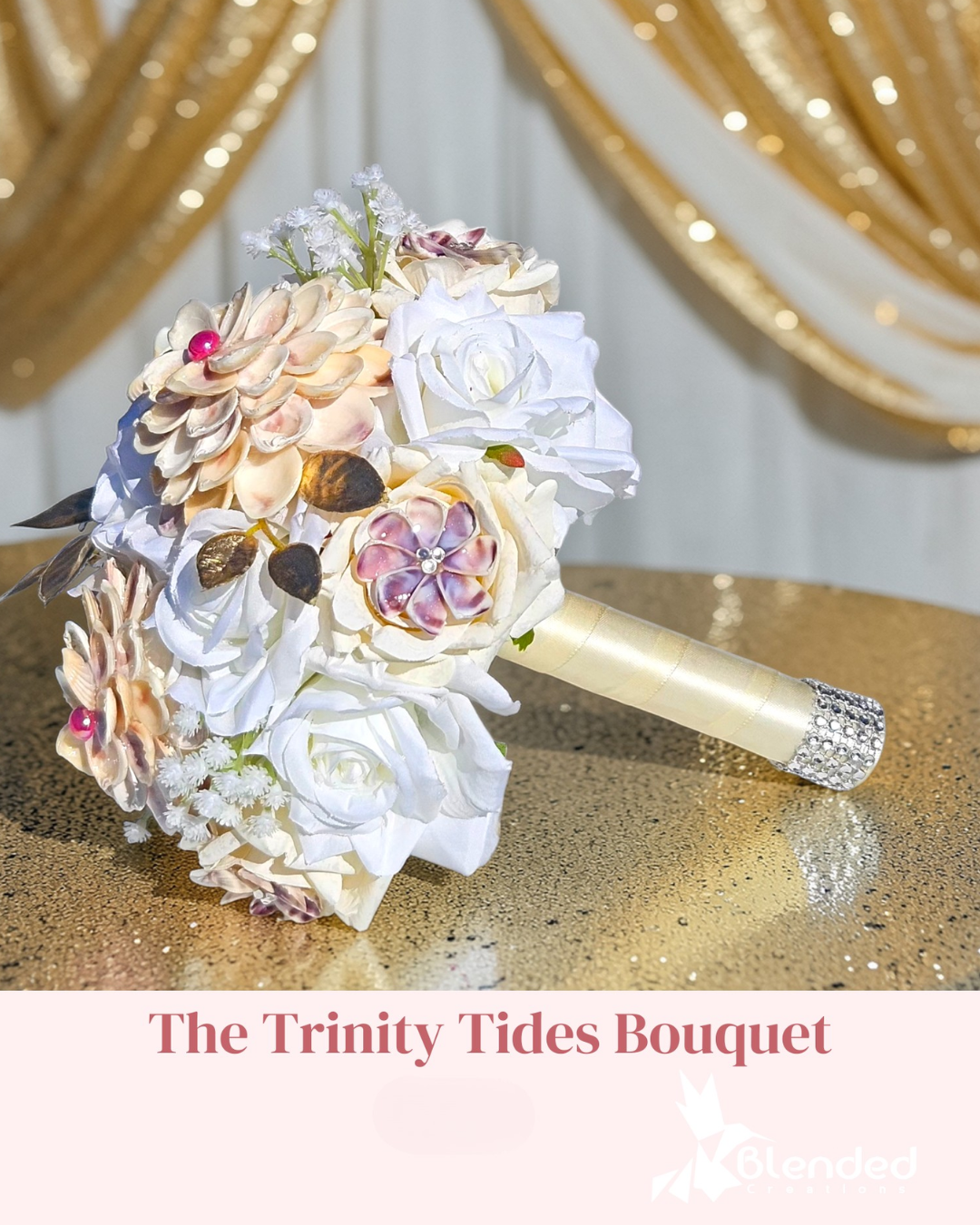 White wedding bouquet with shell flowers on a gold tablescape.